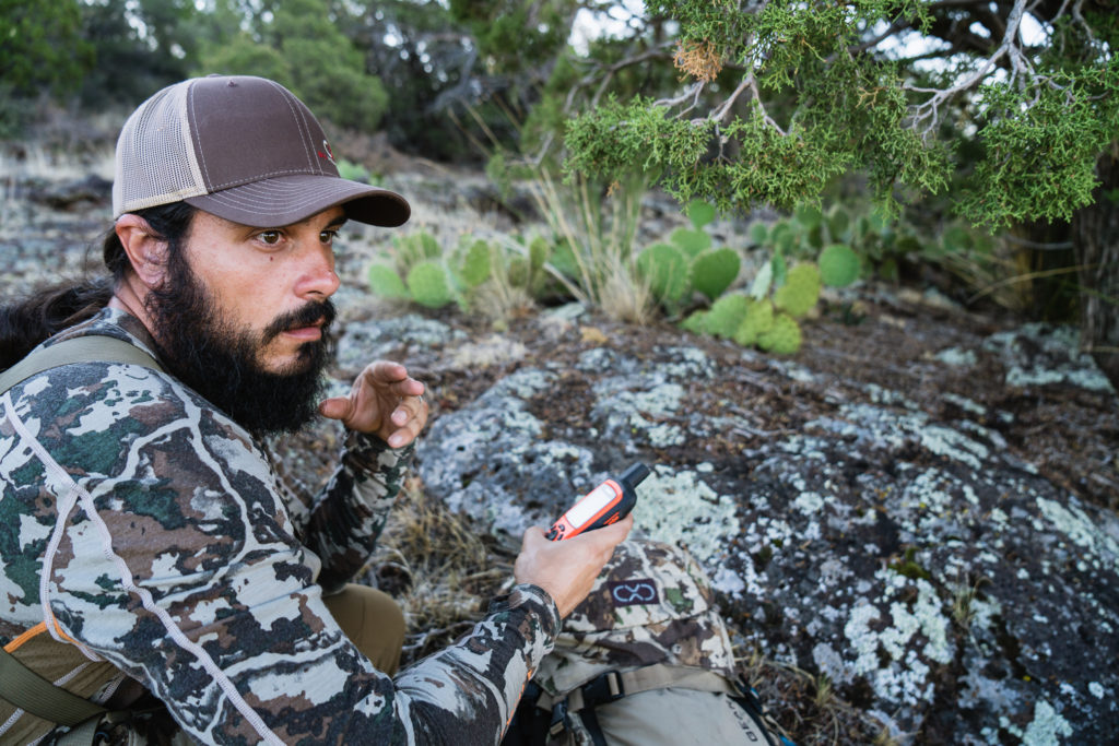 Josh from Dialed in Hunter on a scouting trip for bear marking a waypoint on his GPS