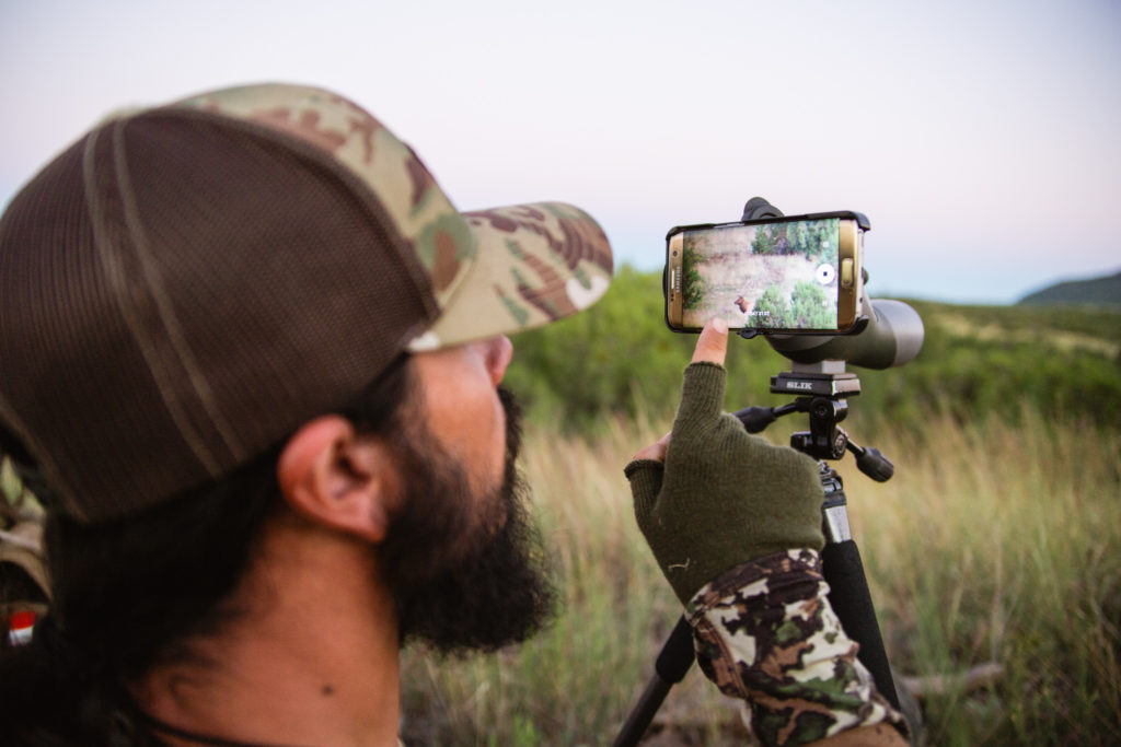 Josh from Dialed in Hunter getting phoneskope footage of a bull elk in Arizona