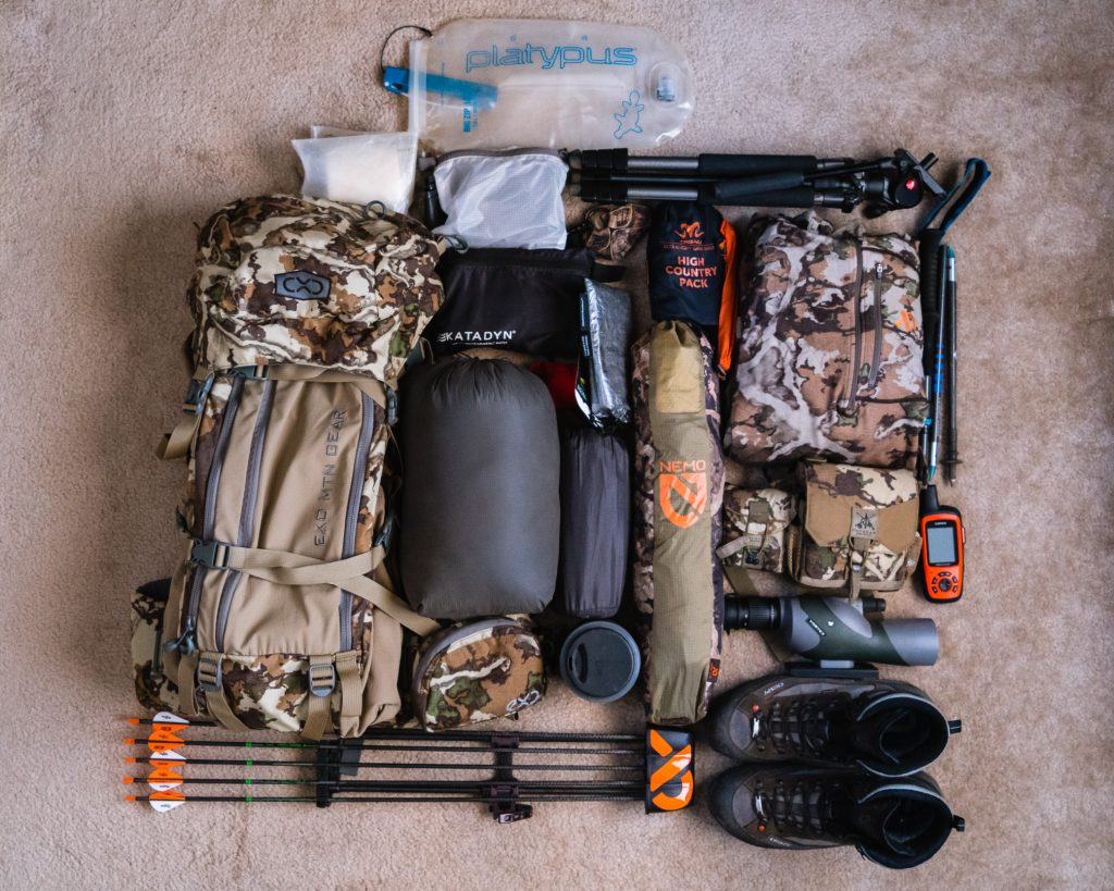 Flat lay of gear for a high country mule deer hunt.