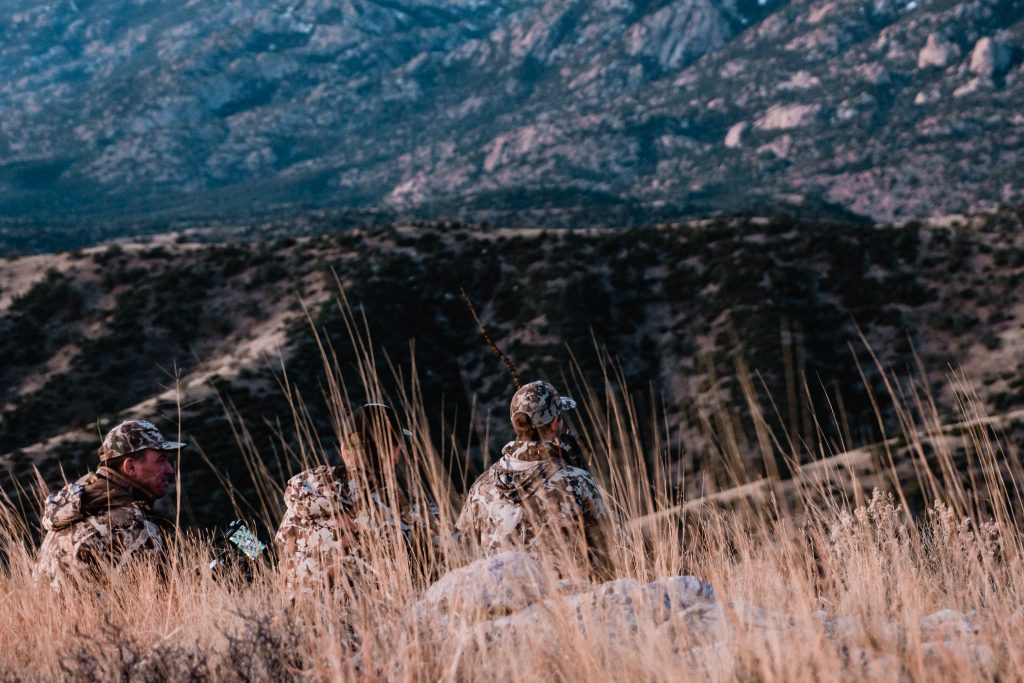 A couple of hunters glassing for coues deer in southern arizona