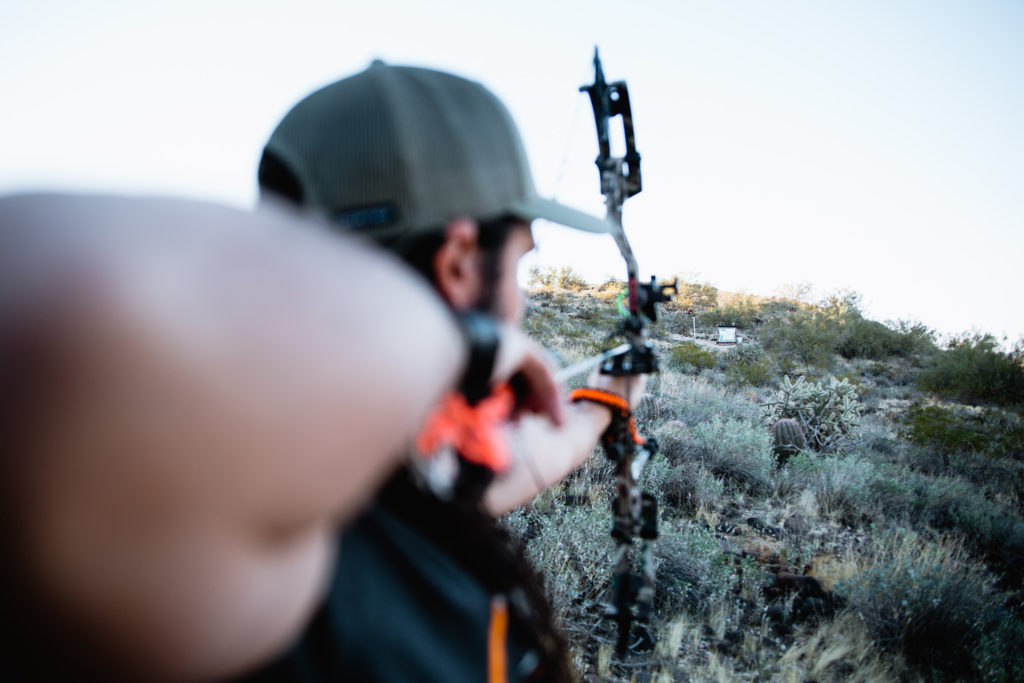 Josh Kirchner from Dialed in Hunter at full draw at the archery range