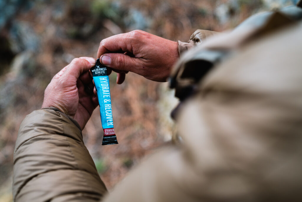 Wilderness Athlete Hydrate and Recover being used to fight off cramping in the backcountry