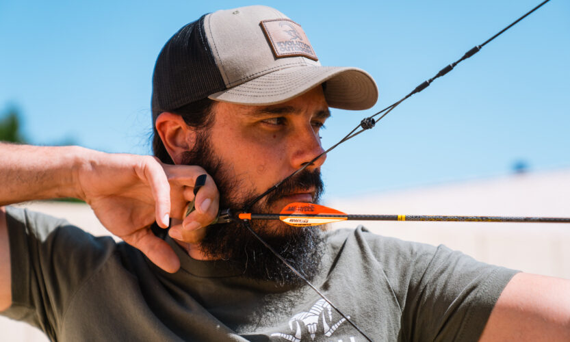 Josh Kirchner at full draw shooting his compound bow practicing his archery accuracy