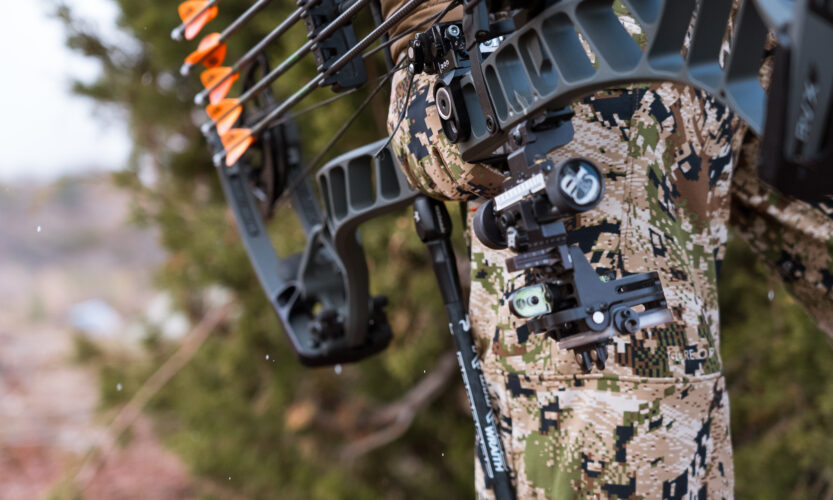 Josh Kirchner holding his bow on a coues deer hunt in Arizona