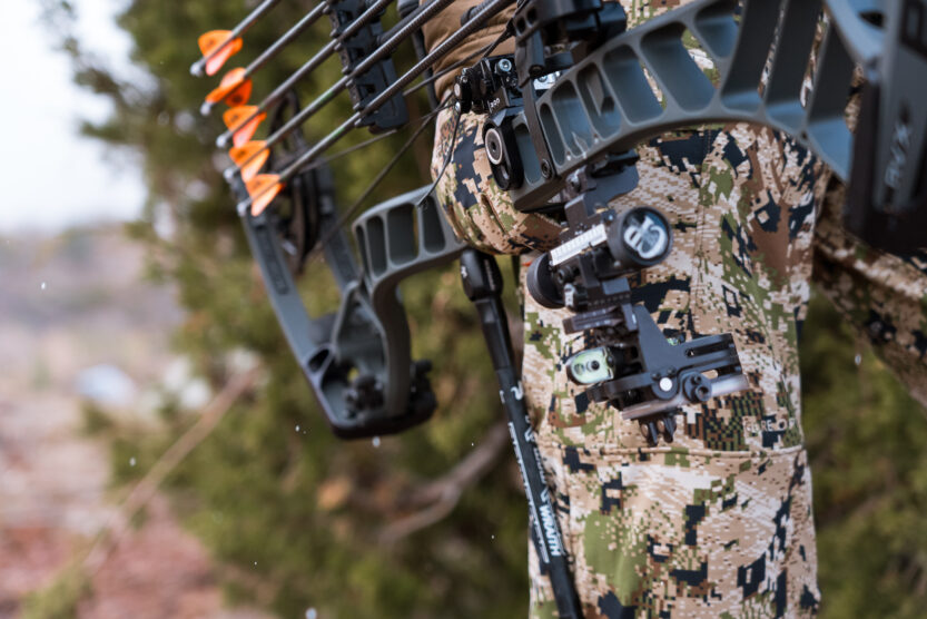 Josh Kirchner holding his bow on a coues deer hunt in Arizona