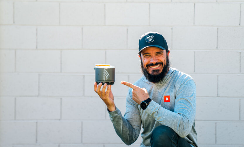 Josh Kirchner holding a Jetboil Stash Stove for backpack hunting