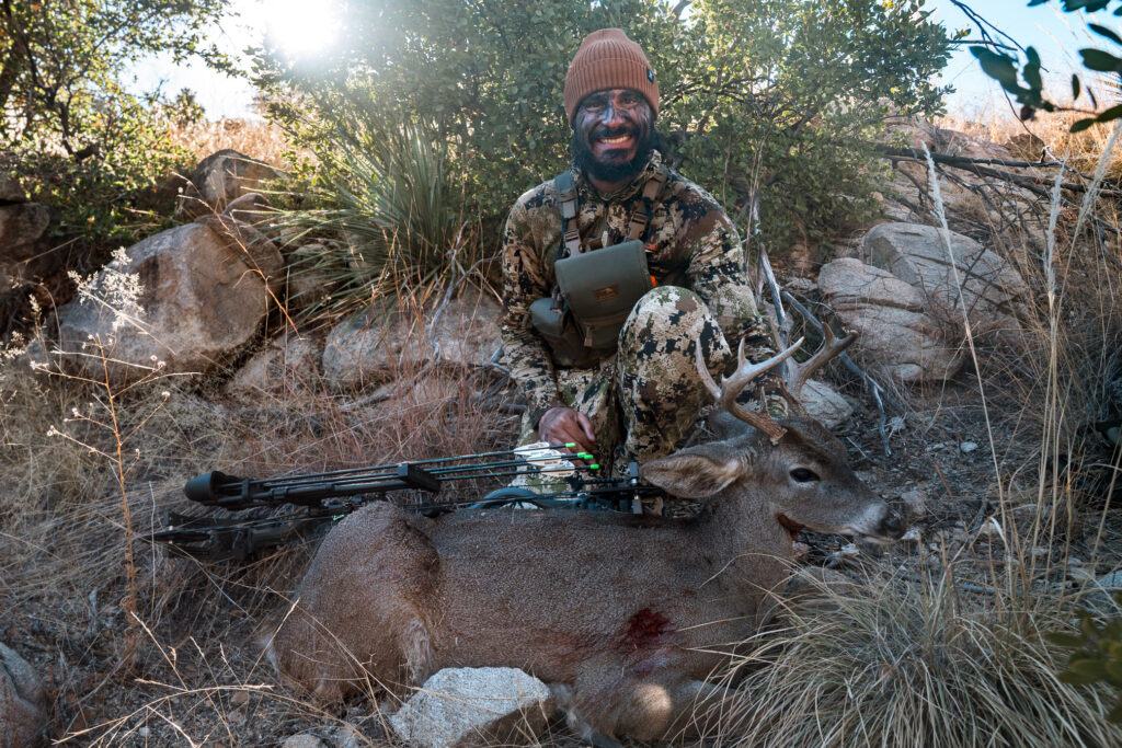 Josh Kirchner with a Coues deer buck he shot with his bow in Arizona