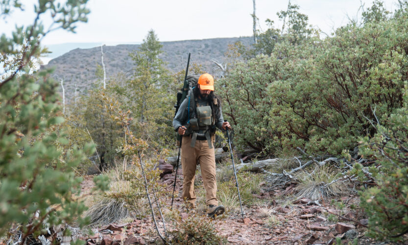 Josh Kirchner hiking in the backcountry on a bear hunt in Arizona