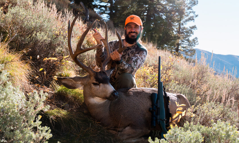 Josh Kirchner with an October mule deer he harvested in a mountain state after diligent e-scouting