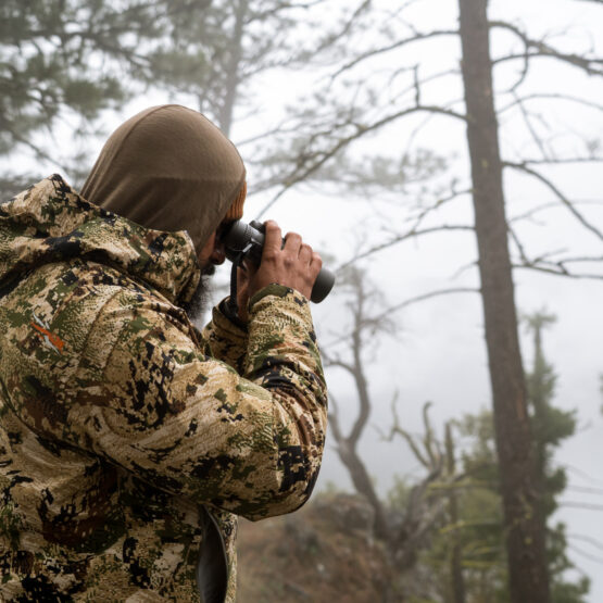 Josh Kirchner from Dialed in Hunter glassing for bears with binoculars during the spring time