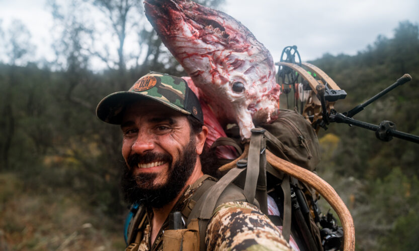 Josh Kirchner from Dialed in Hunter packing out a bull elk from an archery hunt in Arizona