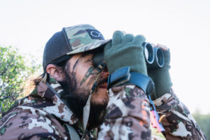 Josh from Dialed in Hunter glassing for elk on his 2018 archery elk hunt in arizona