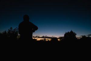 Josh's brother Jake enjoying a sunset on an archery elk hunt in Arizona
