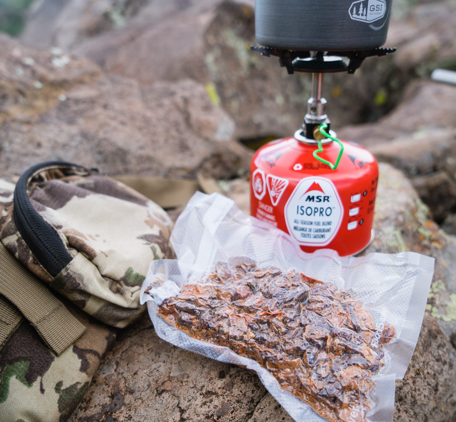 Josh from dialed in hunter's homemade bear chili on a bear hunt in arizona