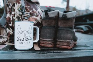 boot, coffee, and backpack on the tailgate and ready to scout