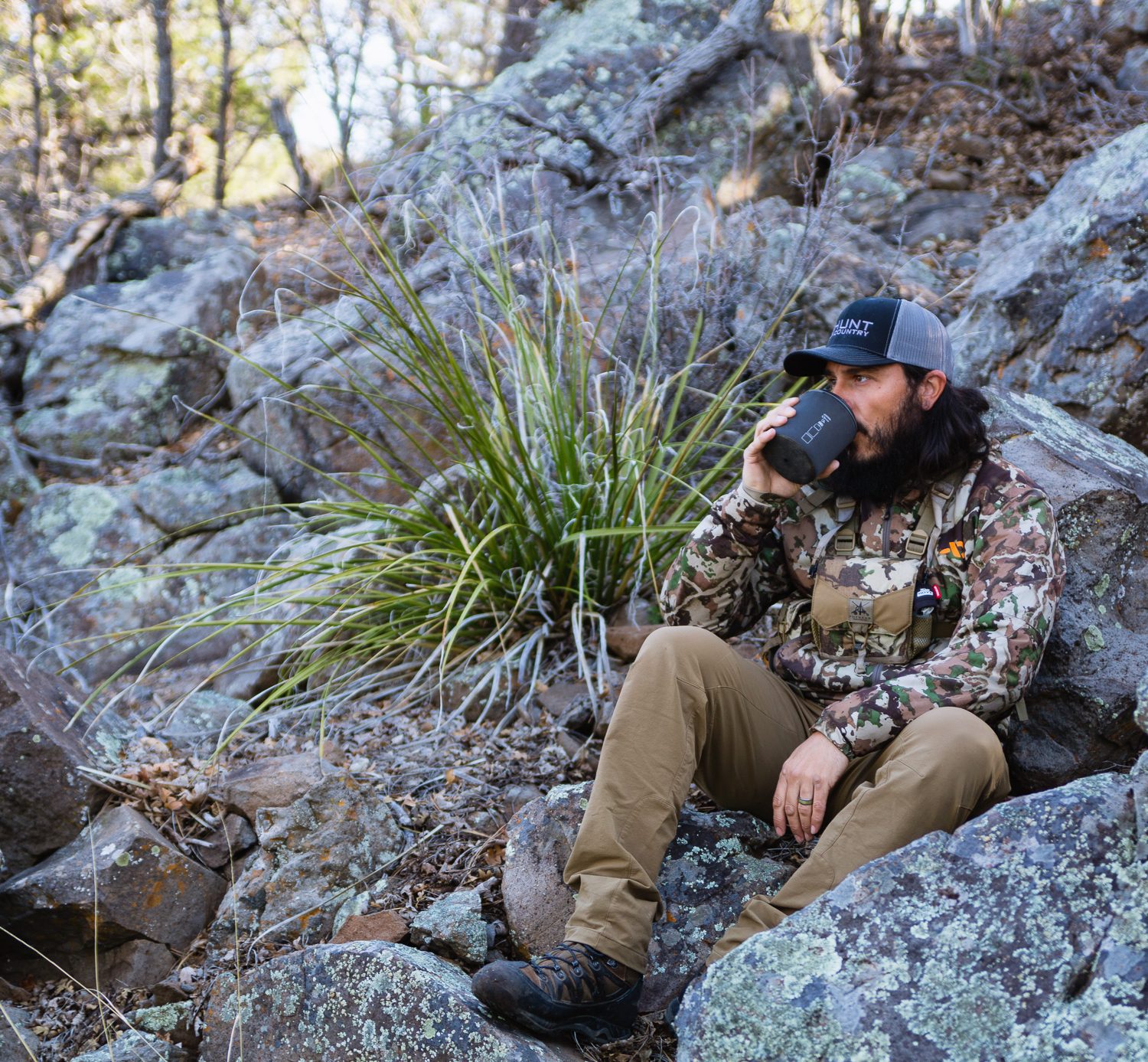 Josh from dialed in hunter drinking coffee in the backcountry