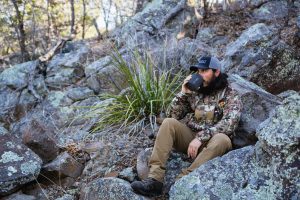 Josh from dialed in hunter drinking coffee in the backcountry