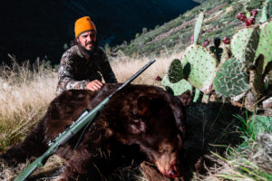 Josh Kirchner from Dialed in Hunter with a Fall Black Bear he harvested in Arizona