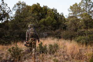 Josh Kirchner from Dialed in Hunter hiking out of the backcountry