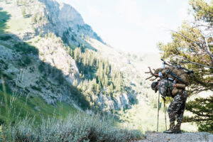 Josh Kirchner from Dialed in Hunter packing out a mule deer on his solo backcountry bowhunting trip to Utah