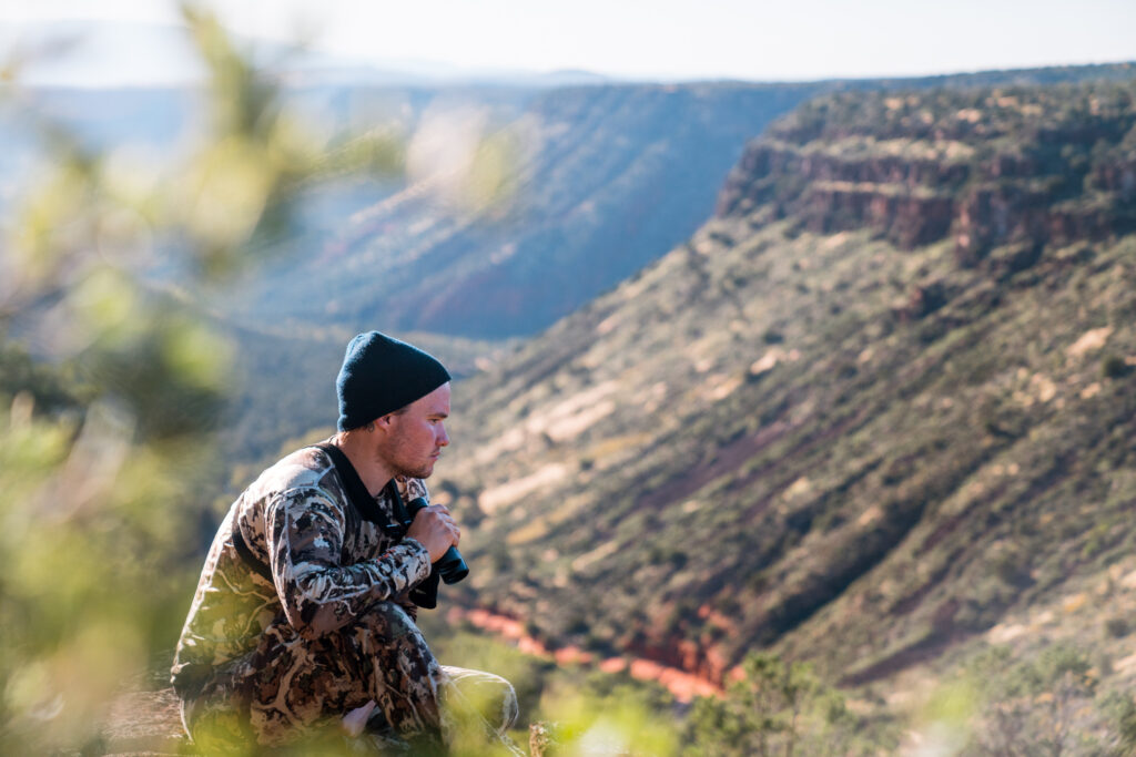 Josh's hunting partner Cody glassing for bears in a nasty canyon during an October hunt.