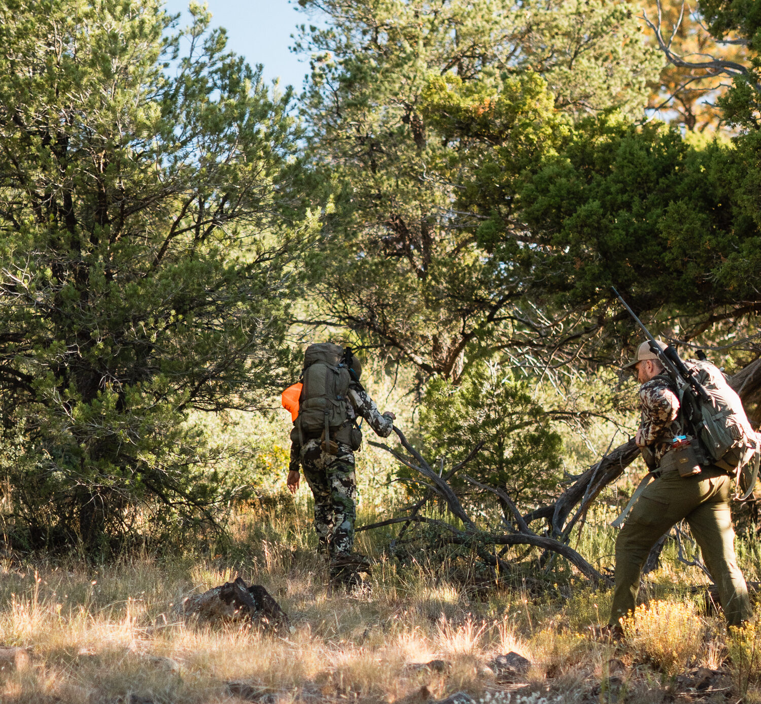 Josh Kirchner and hunting partner hiking on a bear hunt in Arizona