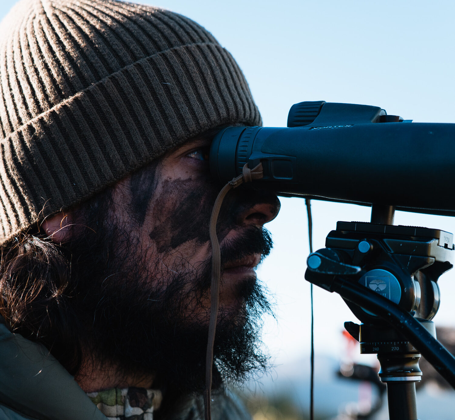 Josh Kirchner from Dialed in Hunter glassing for mule deer