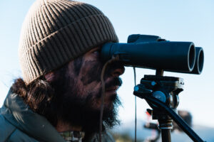 Josh Kirchner from Dialed in Hunter glassing for mule deer