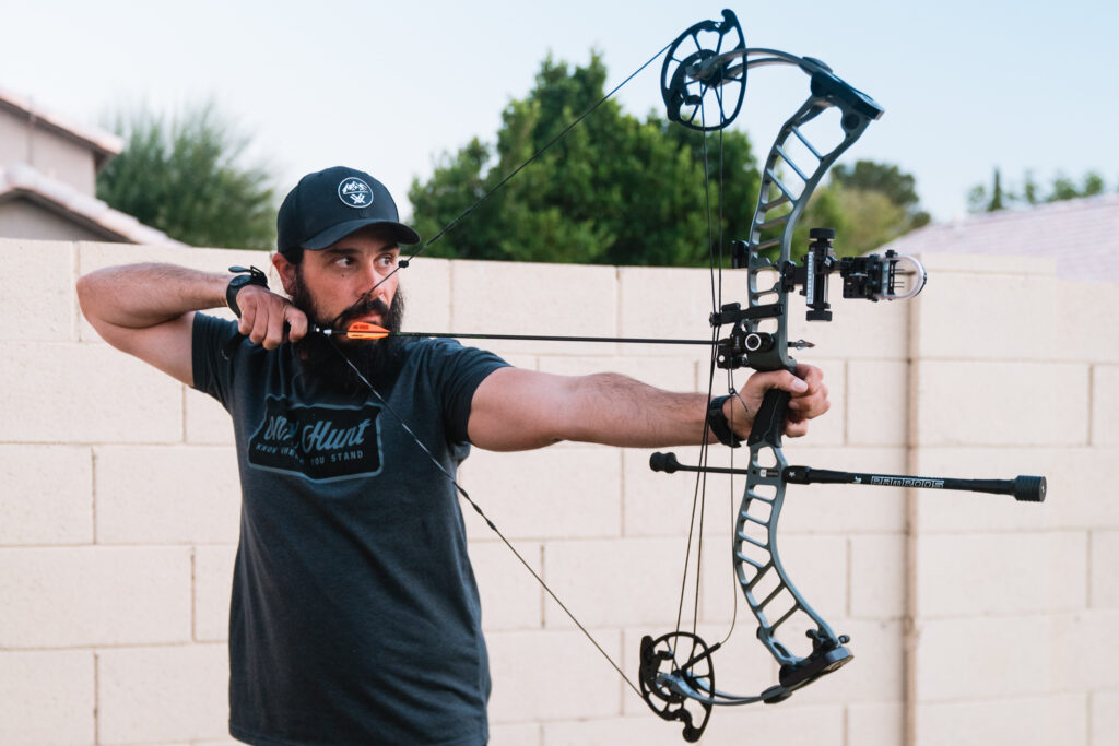 Josh Kirchner from Dialed in Hunter shooting his bow in his backyard