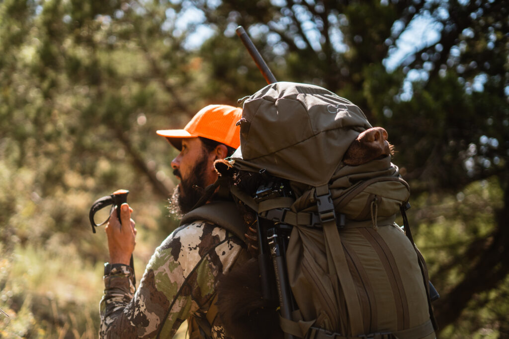 Josh Kirchner from Dialed in Hunter packing out a fall black bear in Arizona