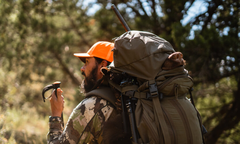 Josh Kirchner from Dialed in Hunter packing out a fall black bear on a hunt in Arizona