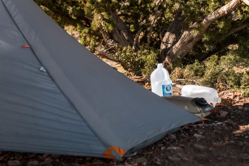 A water stash by Josh Kirchner's tent on a backpack hunt in Arizona