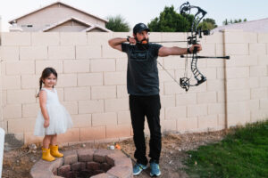 Josh Kirchner from Dialed in Hunter shooting his bow with his daughter