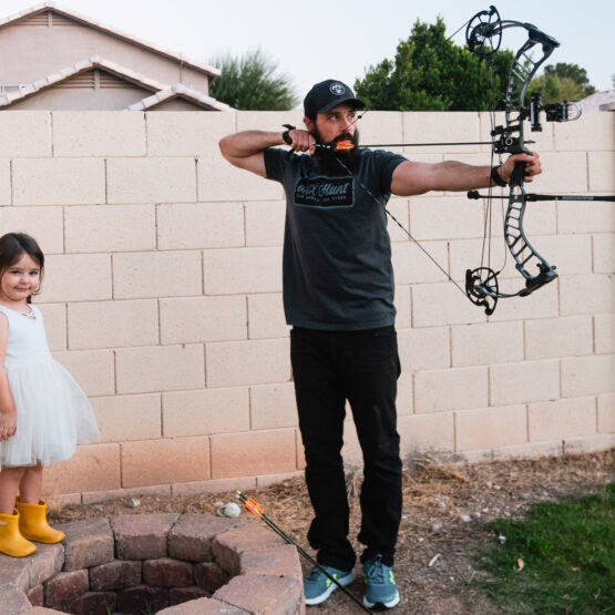 Josh Kirchner from Dialed in Hunter shooting his bow with his daughter
