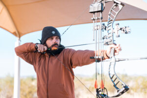 Josh Kirchner from Dialed in Hunter using an index style release aid to practice shooting his bow at the archery range in Arizona