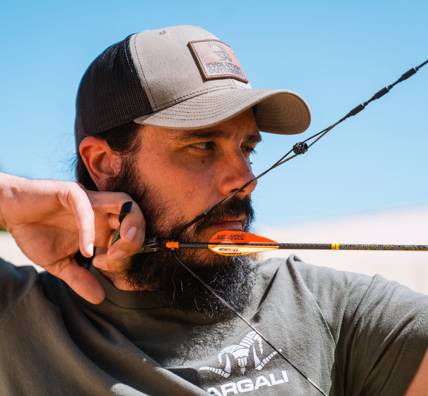 Josh Kirchner at full draw shooting his compound bow practicing his archery accuracy
