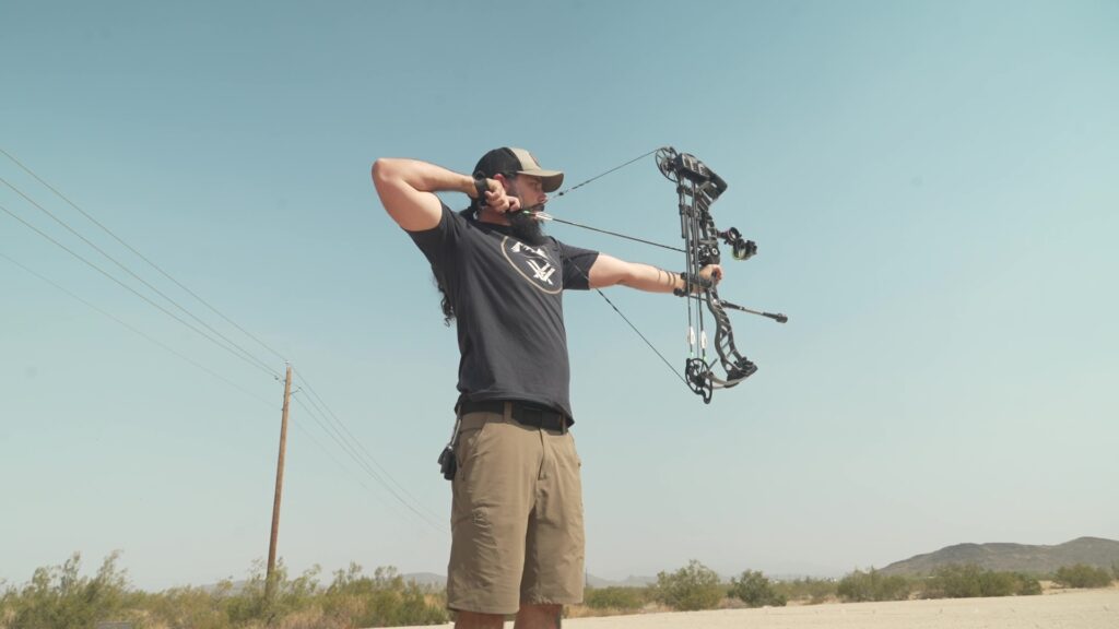 Josh Kirchner practicing shooting his bow at the archery range in Arizona