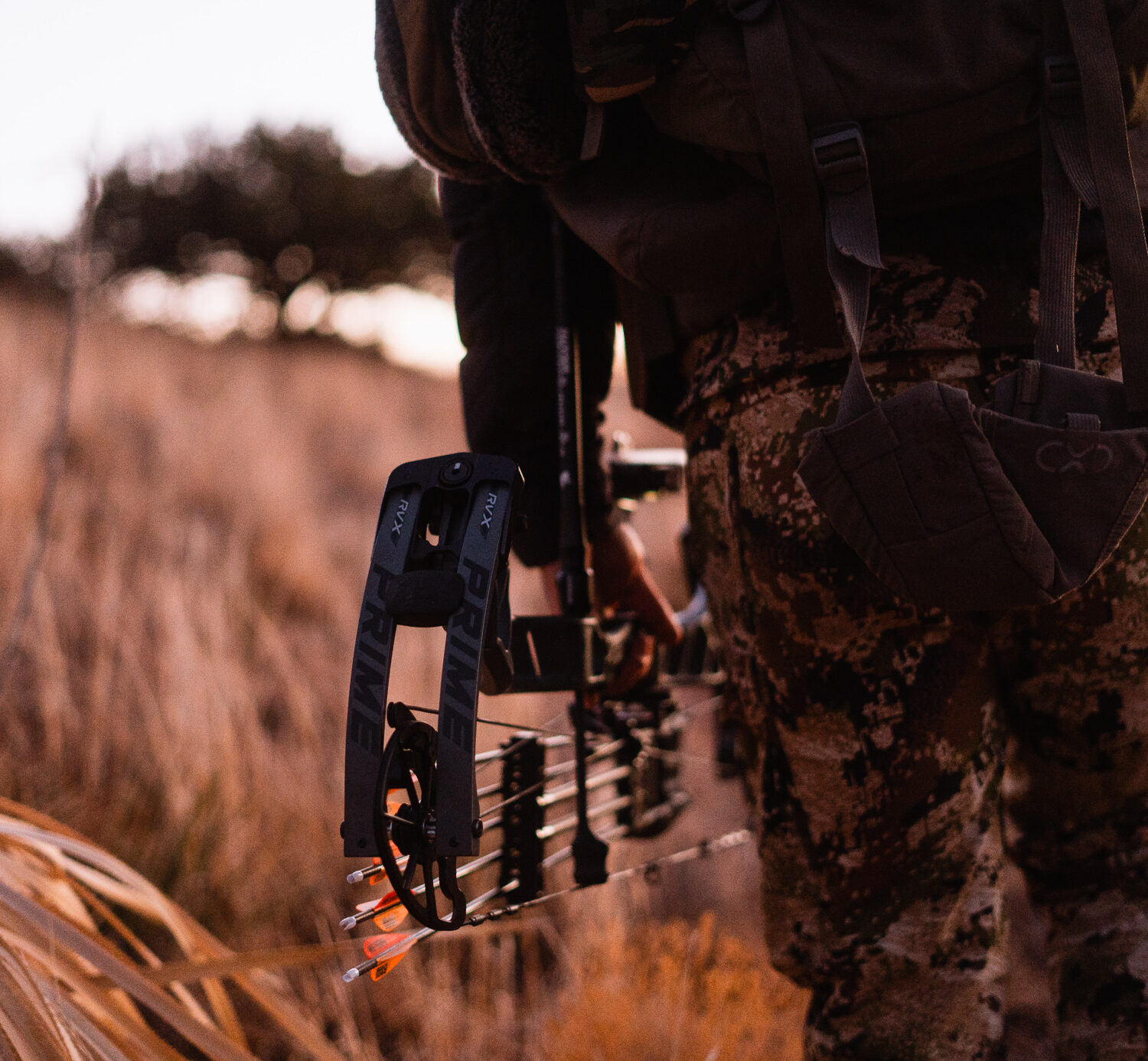 Josh Kirchner from Dialed in Hunter holding a bow at his side on an archery hunt for coues deer in Arizona