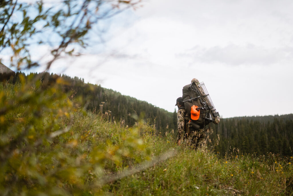 Josh Kirchner backpacking into elk camp