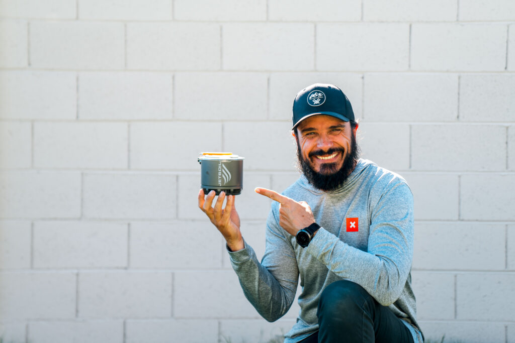 Josh Kirchner from Dialed in Hunter holding the Jetboil Stash stove for backpack hunting