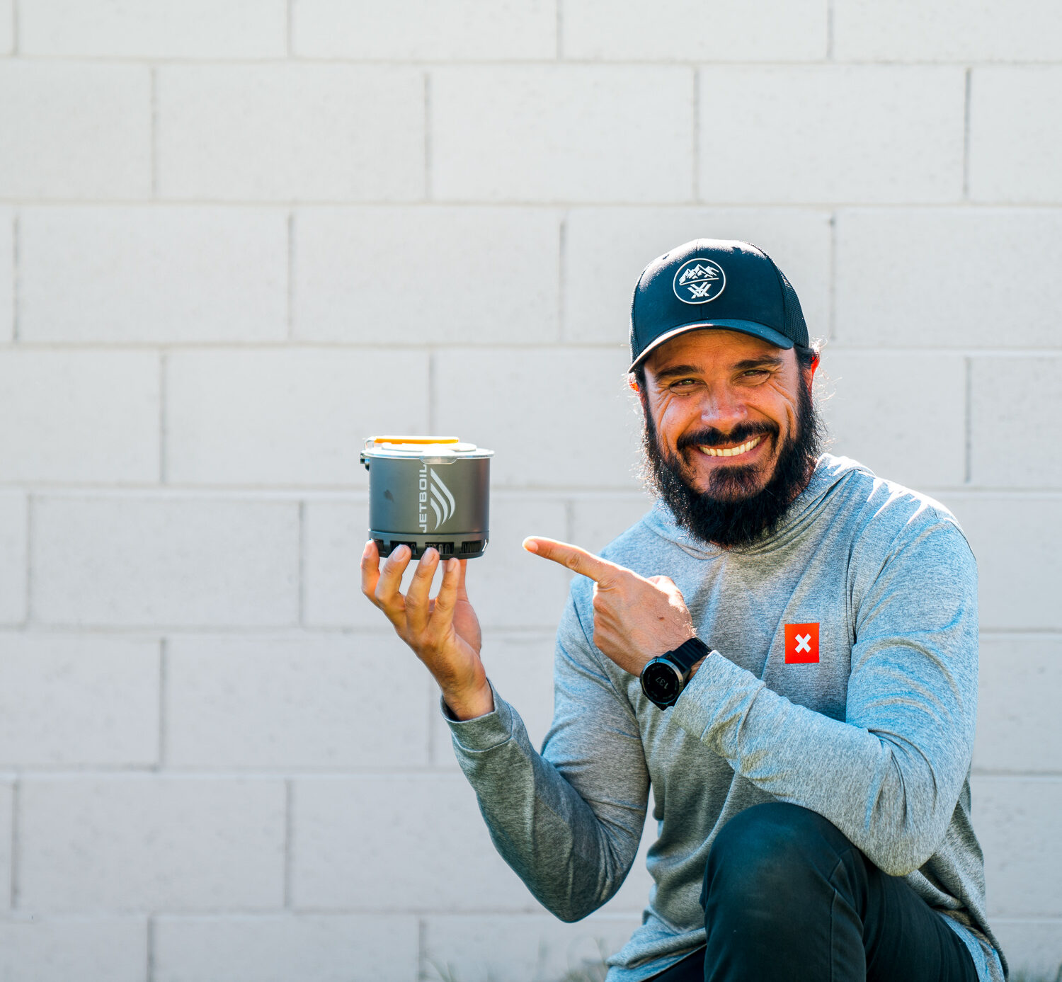 Josh Kirchner holding a Jetboil Stash Stove for backpack hunting