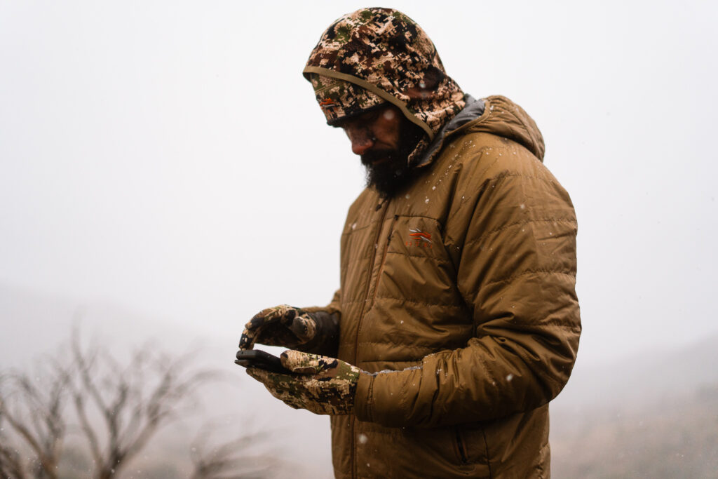 Sitka Kelvin Aerolite Jacket being worn on during a snow flurry on an archery deer hunt in Arizona