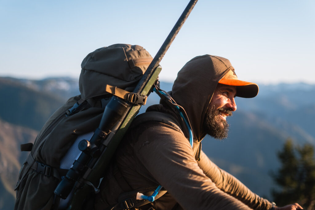 Josh Kirchner smiling while packing out his Idaho black bear.