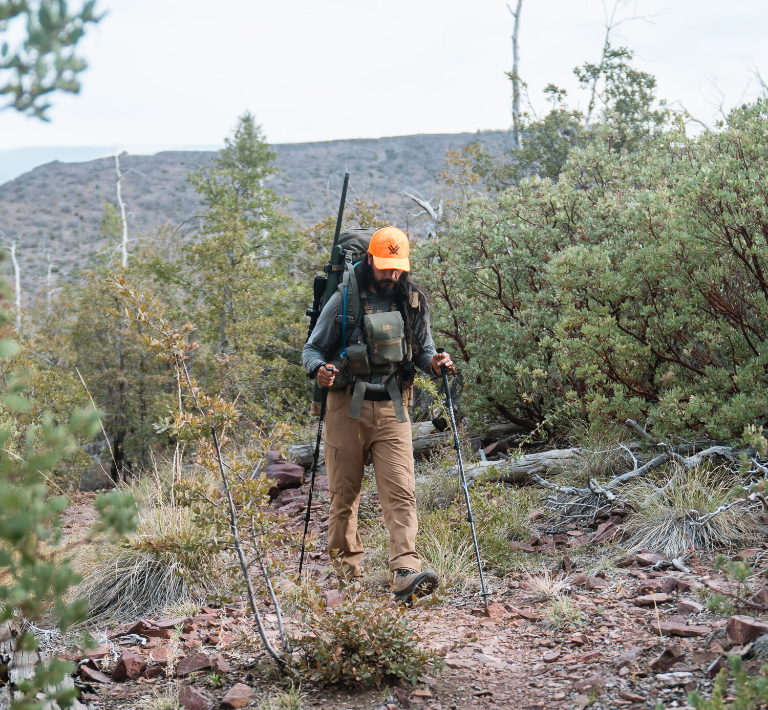 Josh Kirchner hiking in the backcountry on a bear hunt in Arizona