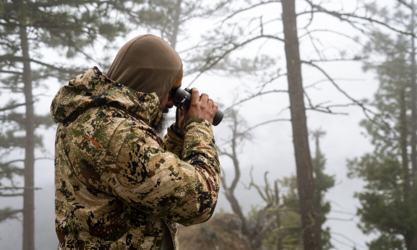 Josh Kirchner from Dialed in Hunter glassing for bears with binoculars during the spring time