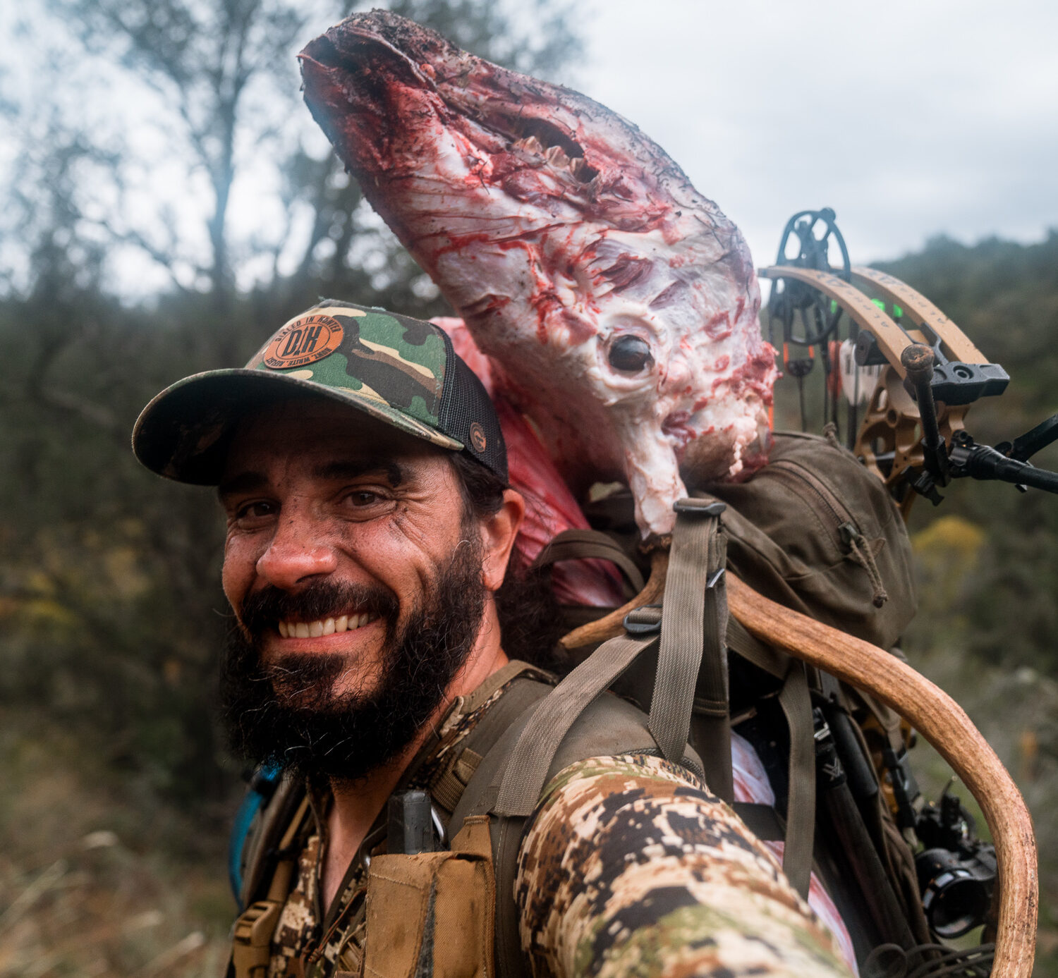 Josh Kirchner from Dialed in Hunter packing out a bull elk from an archery hunt in Arizona