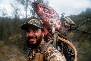 Josh Kirchner from Dialed in Hunter packing out a bull elk from an archery hunt in Arizona