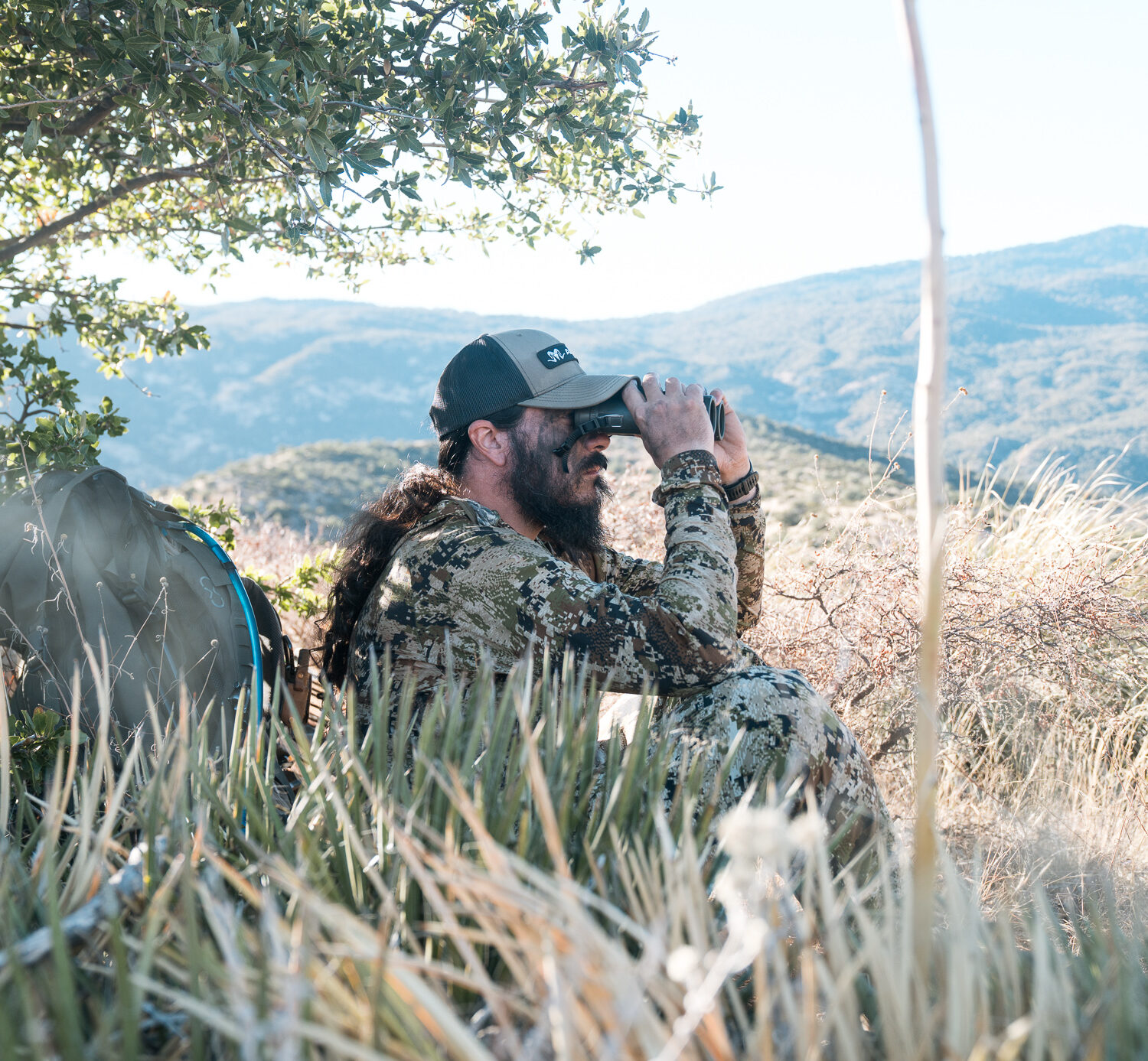 Josh Kirchner glassing the deserts of Arizona for Coues deer with 10x42 binoculars