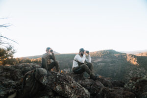 Josh Kirchner from Dialed in Hunter with his hunting partner glassing for bears in Arizona on a scouting trip