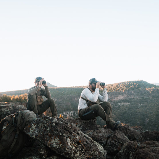 Josh Kirchner from Dialed in Hunter with his hunting partner glassing for bears in Arizona on a scouting trip
